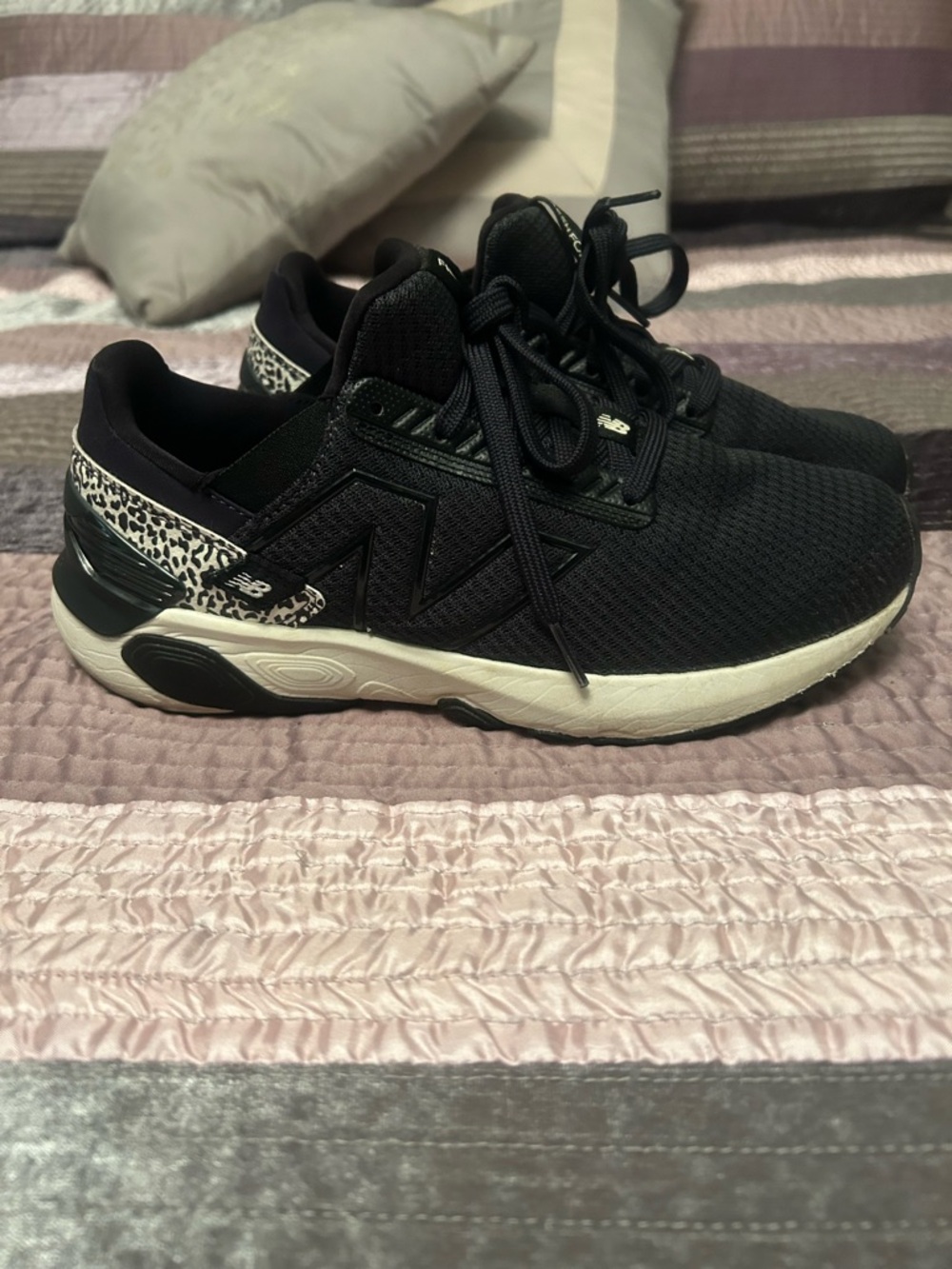 Ladies 9.5 wide New Balance Black with Cream Midsole and Leopard Accent Sneakers